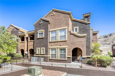 View of front of home with fence, a tiled roof, co