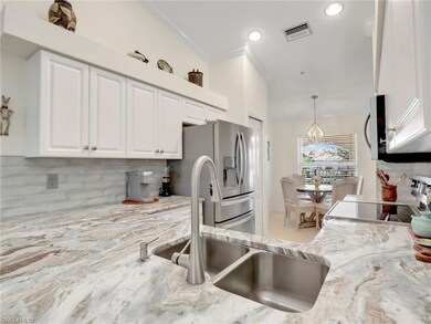 Kitchen with decorative backsplash, stainless stee