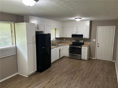 Kitchen sits behind the family room