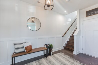 The entry offers an office w/ glass French doors,