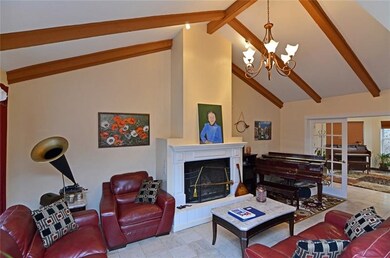 The family room features a raised-hearth fireplace