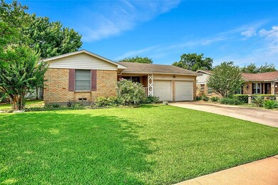 Gorgeous yards front and back. Put away the  water hoses! It has a sprinkler system...