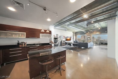 Kitchen with modern cabinets, finished concrete fl