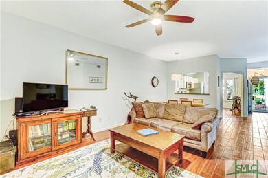 LIVING ROOM WITH UPDATED CEILING FAN