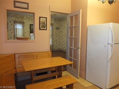 Eat-in kitchen with tile floor.