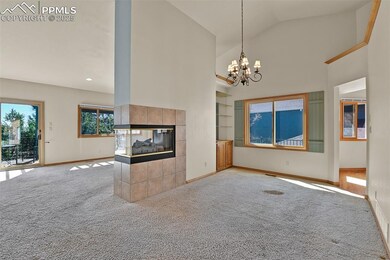 Dining Room and Living Room with shared fireplace.