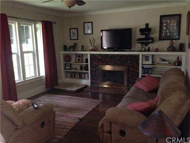 The living room boasts a wood burning fireplace an