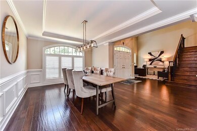 Large dining room with designer fixture and matchi