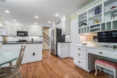 This multi-purpose kitchen houses a desk for doing