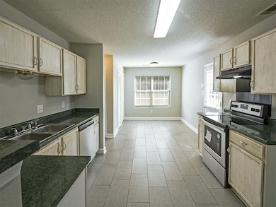 Kitchen featuring light brown cabinets, visible ve