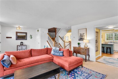 The living room opens to the kitchen and dining ro