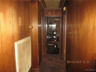 Hallway with wooden walls