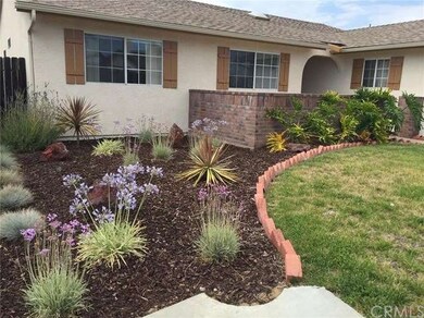Front yard landscaping showing entryway patio.
