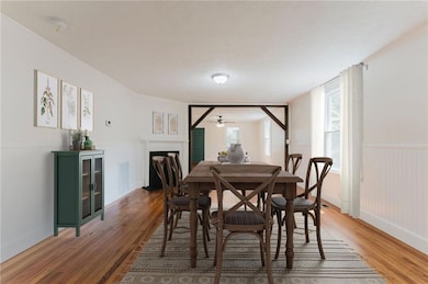 Dining area with dark hardwood / wood-style floors