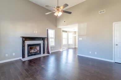 Formal living room with gas fireplace.