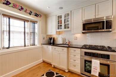 Front bay window with wood blinds