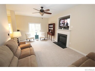 Living Room with carpet, ceiling fan, french doors
