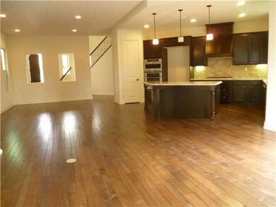 Fabulous plank flooring, pendant lights at kitchen