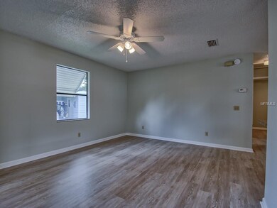 View of spacious LIVING ROOM with CEILING FAN with