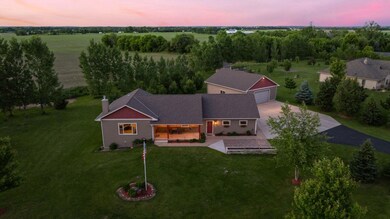 Featuring a two car garage and a detached shed