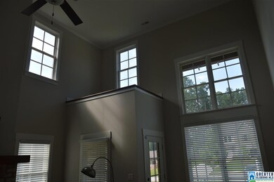 two story living room, with plenty of natural ligh