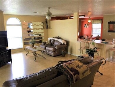 LIVING ROOM AND PART OF KITCHEN
