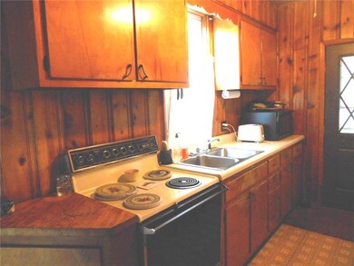 Kitchen with electric stove.
