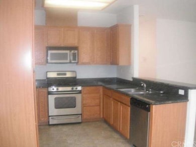 Fully appliance kitchen with counter and eating ar