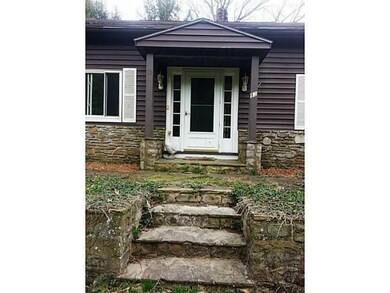 Exterior Front. Beautiful stone surrounds this hom