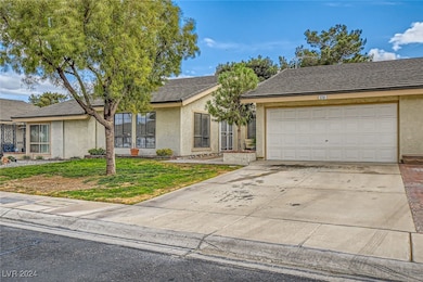 View of front of home featuring stucco siding, con