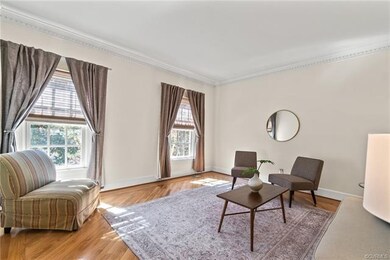 Formal living room overlooking the front of the pr