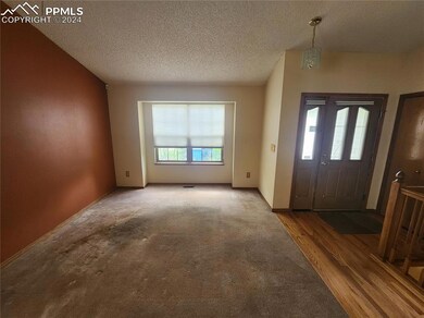 Hardwood entrance foyer with a textured ceiling