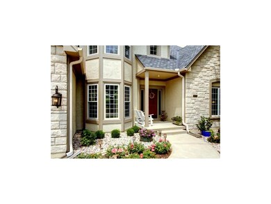 This inviting entryway provides a paved walkway, s