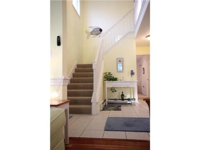 Foyer. Nice entrance has a coat...