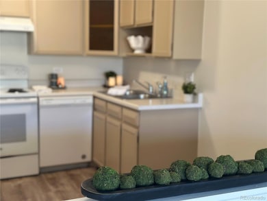 Kitchen with freshly painted cabinets and LVP flooring