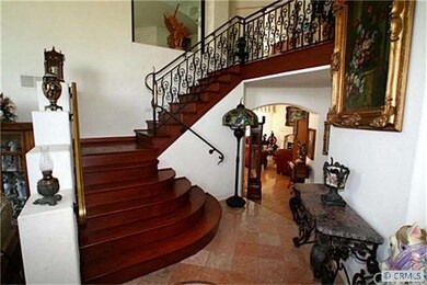 Hardwood staircase in the entry hall.