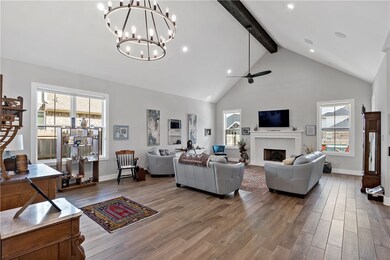 Living room with beam ceiling, ceiling fan with no