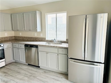 Kitchen featuring appliances with stainless steel