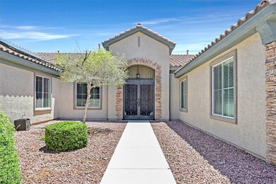 Property entrance featuring stucco siding, a tiled