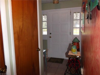 Foyer opens up to the hallway leading to the kitch