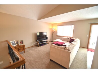Upper level living room. There is new carpet and f