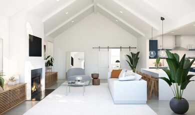 Great room with vaulted ceiling and white-painted ceiling beams