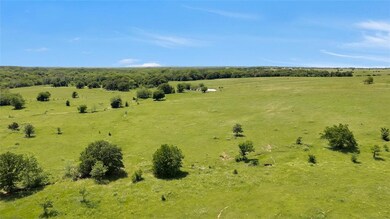Birds eye view of property featuring a rural view