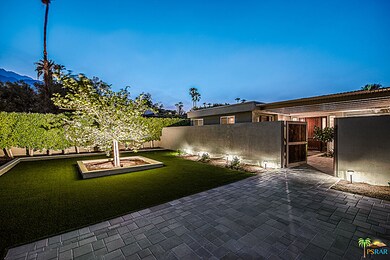 Private entry courtyard lies behind the walled and