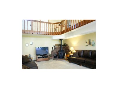 Living room with wood burning fireplace
