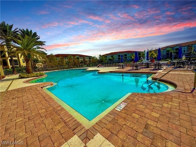 Pool featuring a patio, fence, and a residential v