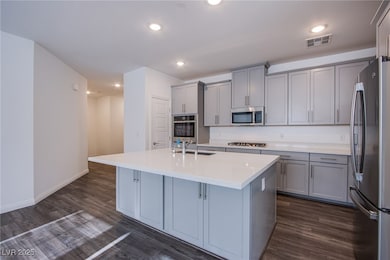 Kitchen featuring stainless steel appliances, gray
