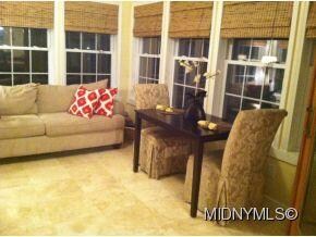 Sunroom with travertine tile