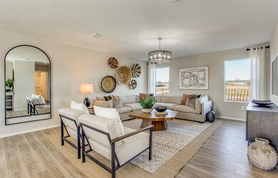 Gathering room drenched in natural light, creating a warm atmosphere *Model representation
