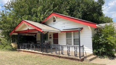 Bungalow-style house with a porch and a front yard